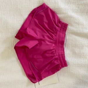 Brand New Sonic Pink Hotty Hot Lululemon shorts (Size 2)